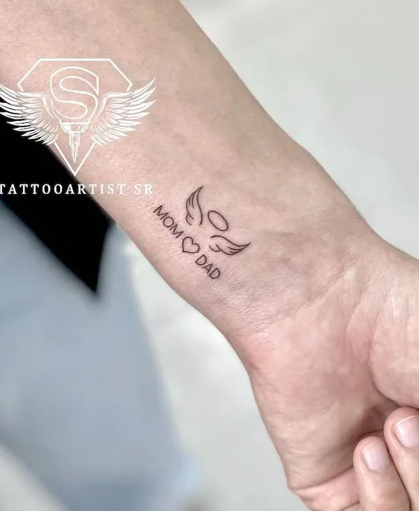 Memorial angel wing tattoo on the wrist by @tattooartist_sr