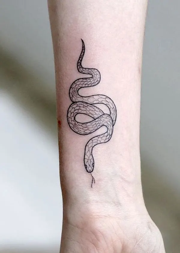 Snake wrist tattoo by @tattooer_dogy