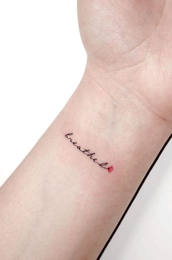 breathe lettering wrist tattoo by @playground_tat2