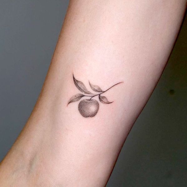 Black and grey apple tattoo by @sonia.pinkdust