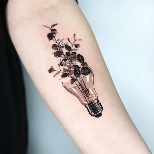 Blooming lightbulb teacher tattoo by @tattooeunb