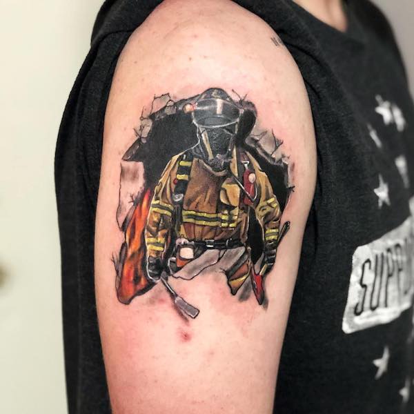 Breaking through the wall firefighter sleeve tattoo by @boernetattooco