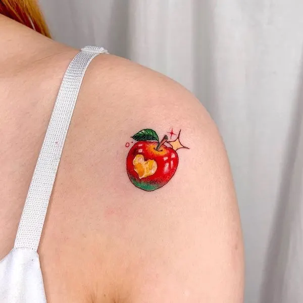 Cute apple shoulder tattoo by @zvee.tt