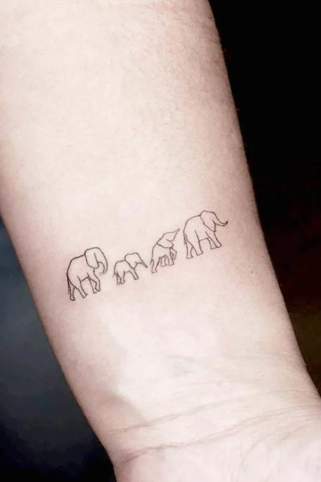 Elephant family tattoo on the wrist by @danirg.home