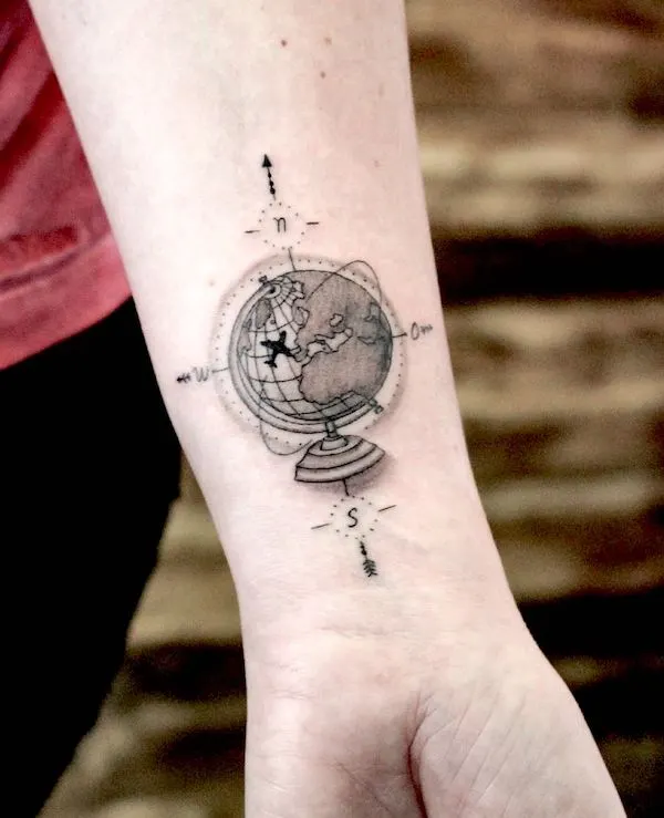 Globe wrist tattoo for teachers by @bjoern_holtappels