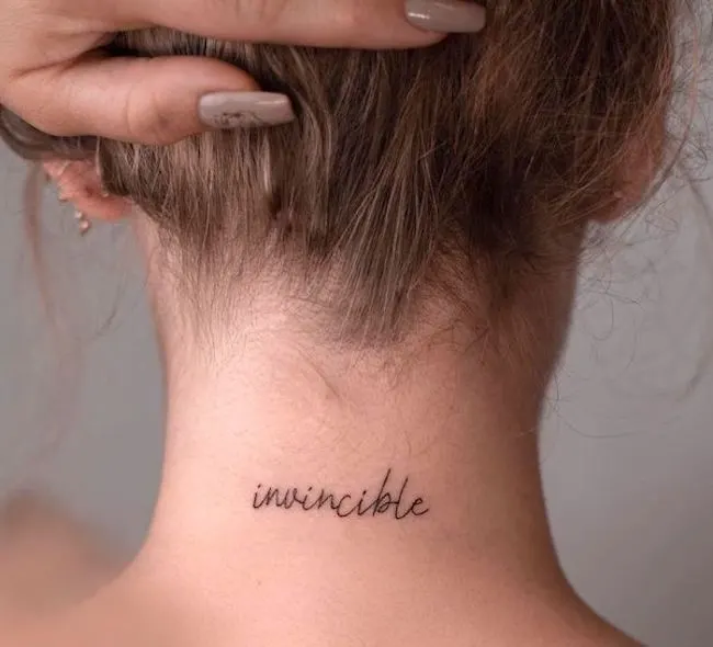 invincible one word tattoo by @pavlenko.ink