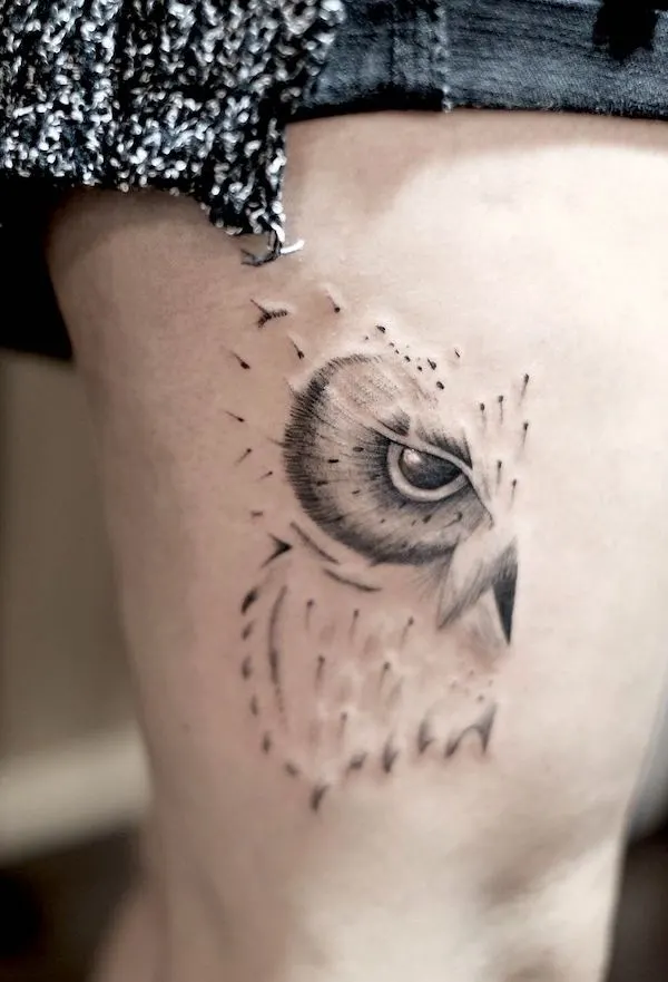 Eye and feather_abstract owl thigh tattoo by @noiram_tattoo