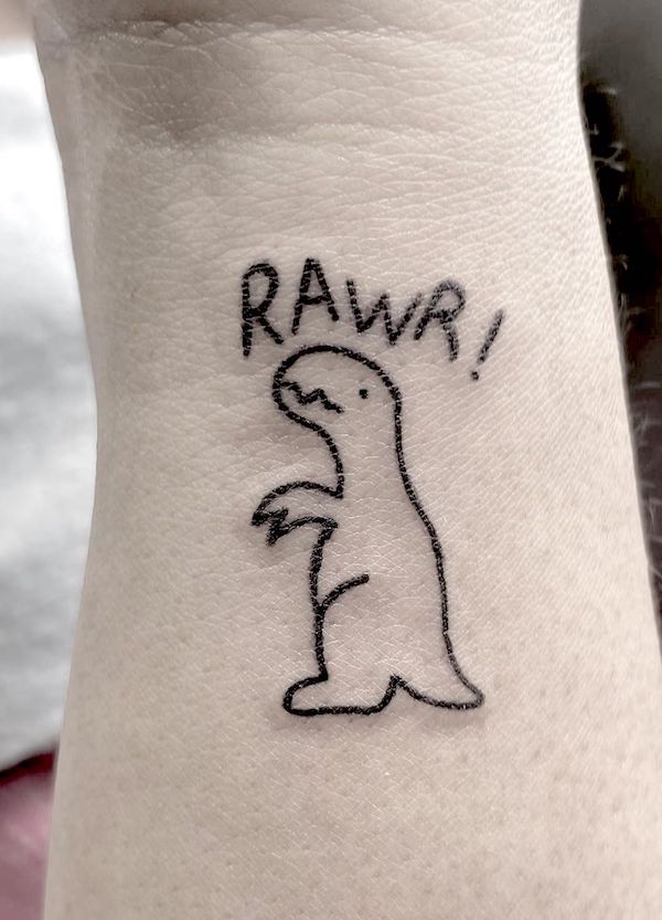 Minimalist cartoon dinosaur wrist tattoo by @lucyvandorttattoos