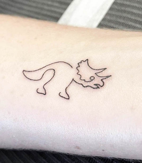 Minimalist small abstract Triceratops tattoo by @_vinz_