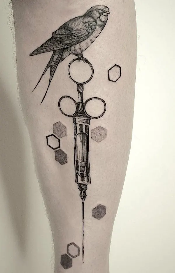 Nightingale and syringe leg tattoo by @krvs_ttt