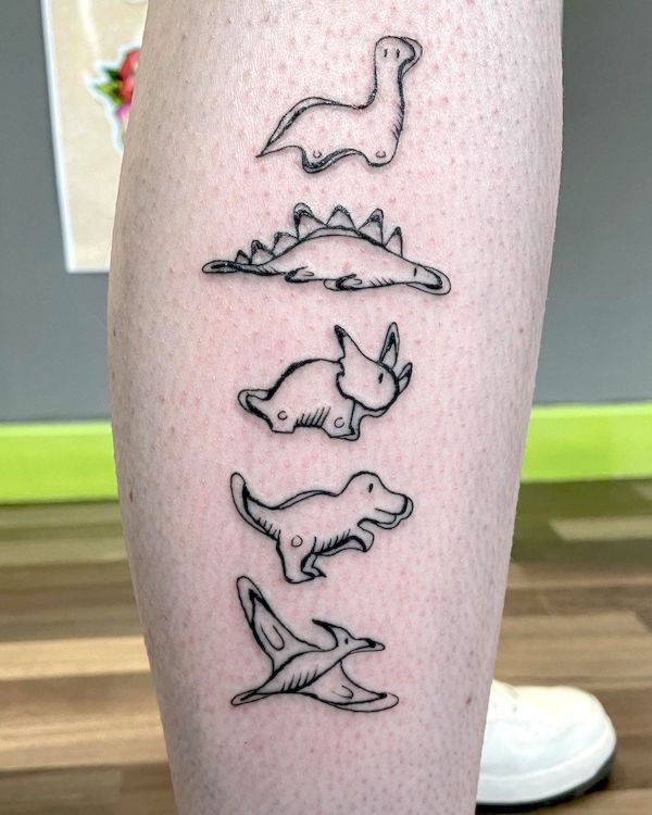 Small dinosaurs calf tattoo by @marksibtattoo