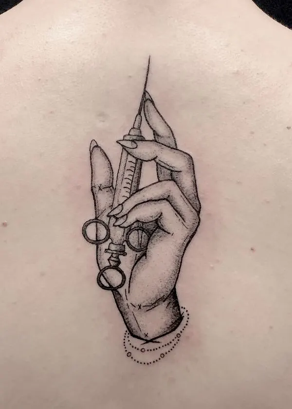 Syringe in the hand nape tattoo by @savolanmuste_jenni