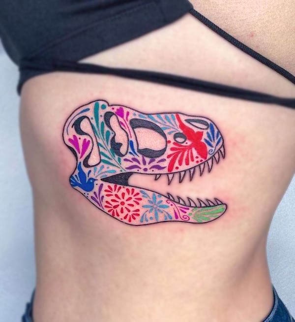 T-rex skull tattoo in colorful floral patterns by @kareninjatattoo