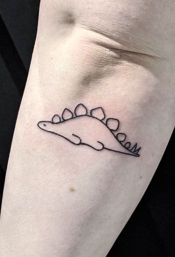 The lazy Stegosaurus tattoo by @blackfoxtattoos