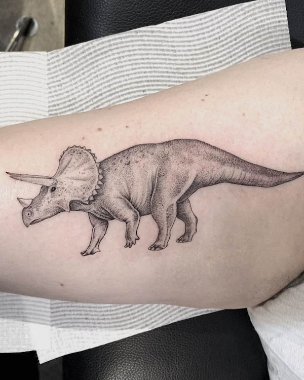 Triceratops arm tattoo with stunning details by @gemicco