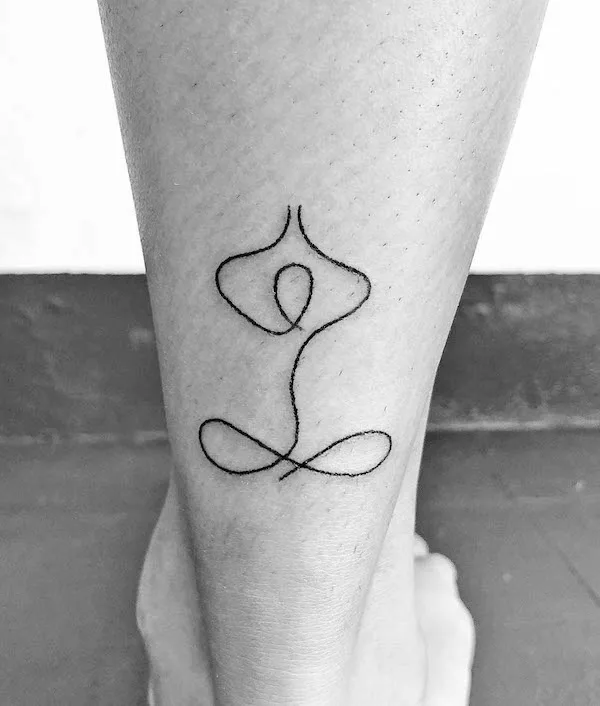 Abstract minimalist yoga tattoo by @handpoke_by_ninie