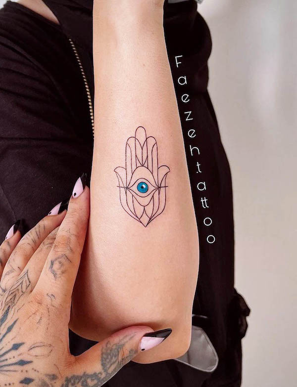 Hamsa hand forearm tattoo by @faezeh.tattoo