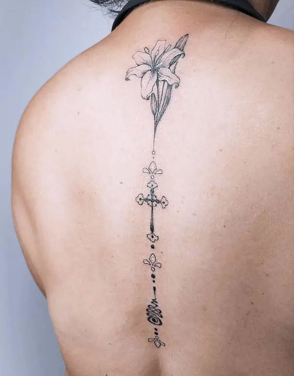 Lily and unalome spine tattoo by @ruang_arati