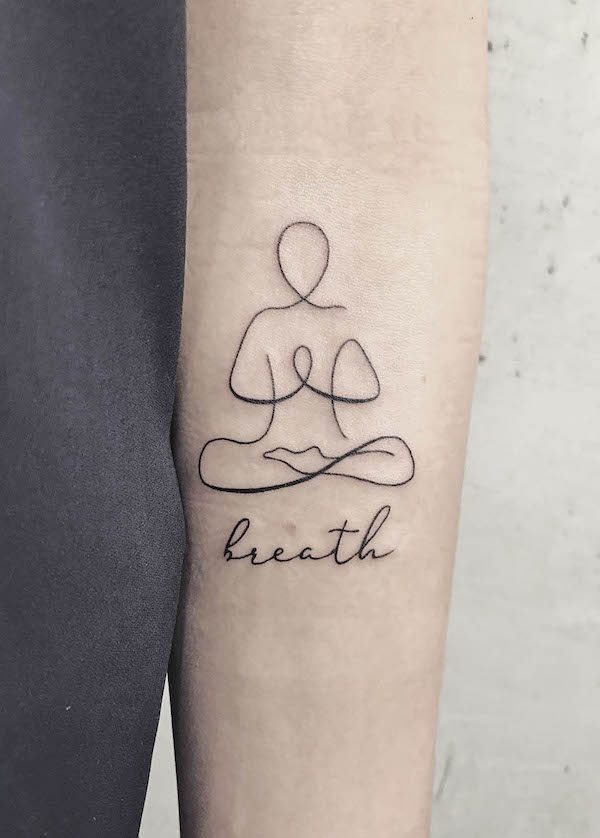 Lotus position one word tattoo by @dominika.skrodzka