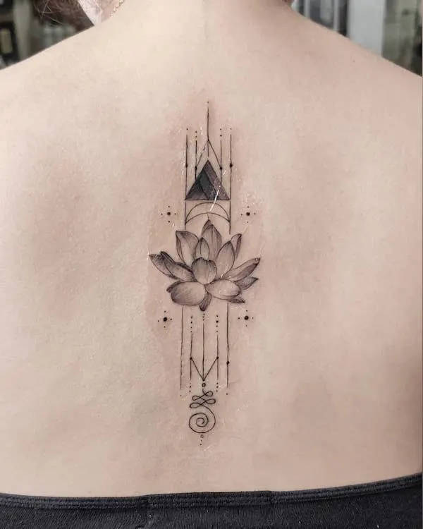 Realism lotus symbol back tattoo by @eshavarpe