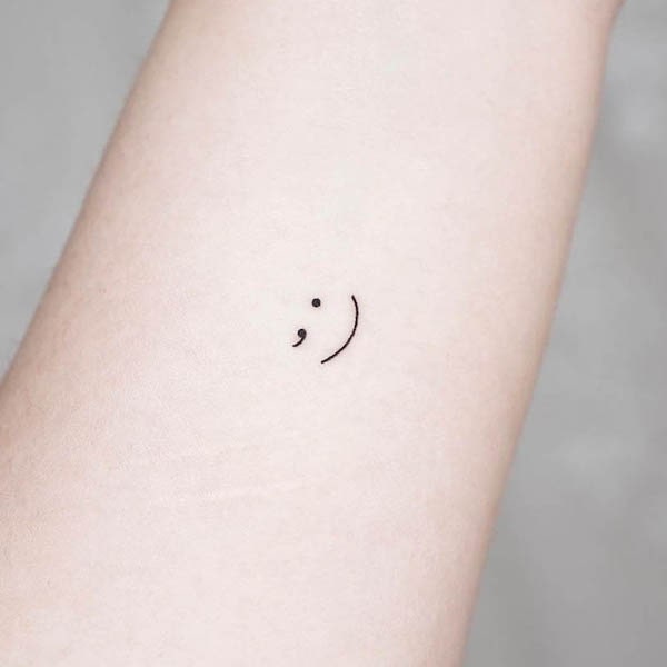 Smiley face semicolon tattoo by @simya_tattoo