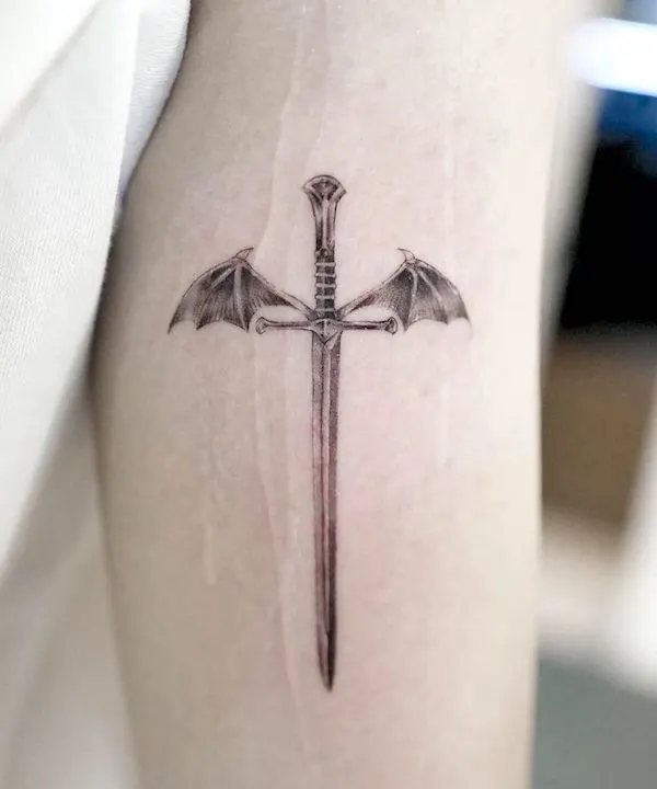 Dragon wing sword strength tattoo by @boomzodat