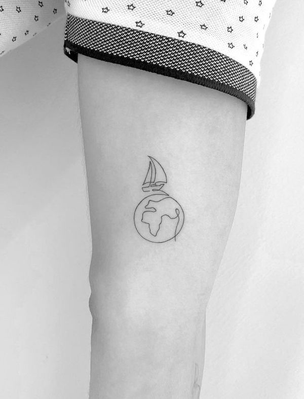 Minimalist boat and world tattoo for travelers by @cagridurmaz