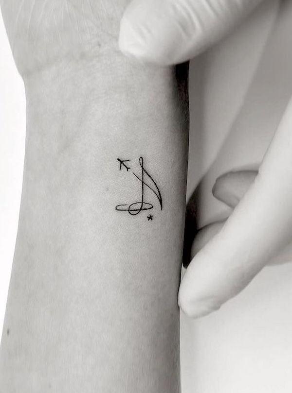 Music and plane small wrist tattoo by @playground_tat2