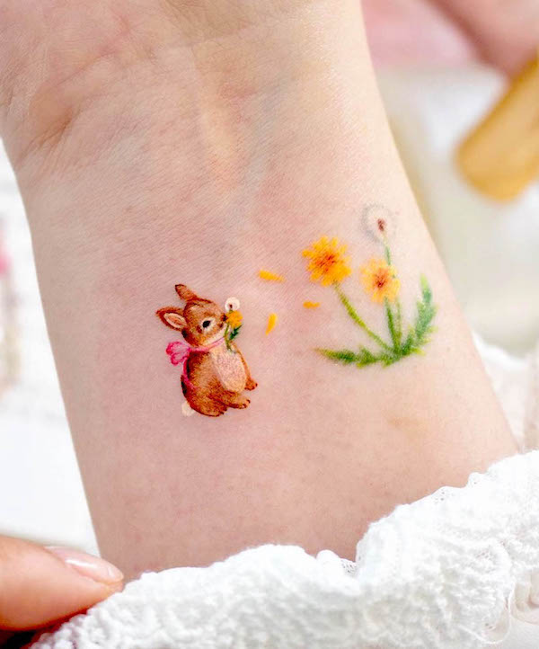Small girly wrist tattoo by @ovenlee.tattoo