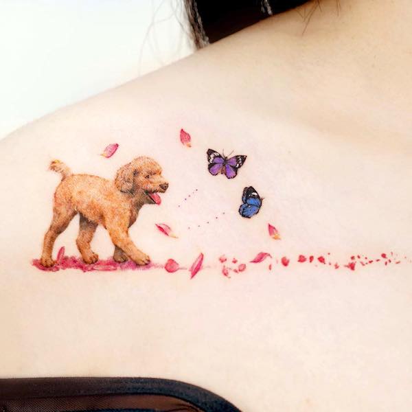 Dog and butterflies collarbone tattoo by @tilda_tattoo