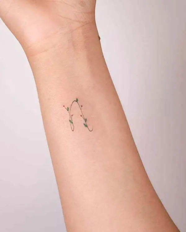 Floral N initial wrist tattoo by @handitrip