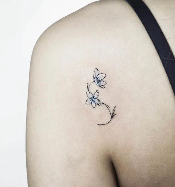 Floral S shoulder tattoo by @nolgida.tattoo