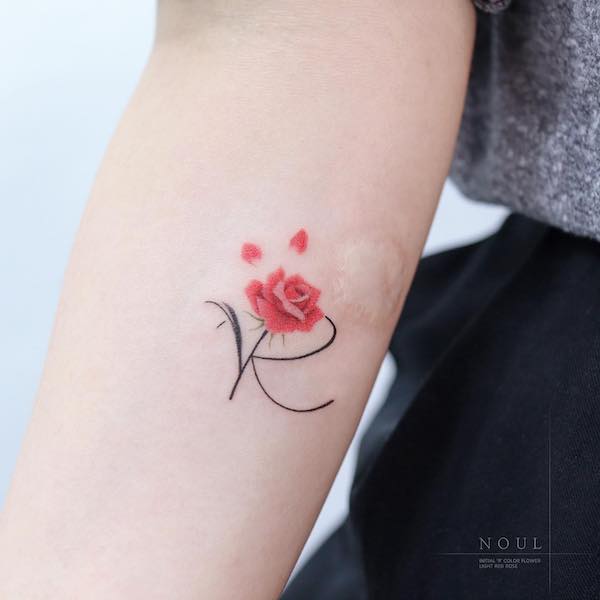 R and rose tattoo by @noul_tattoo