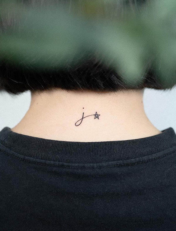 Small J and star nape tattoo by @olive_forestink