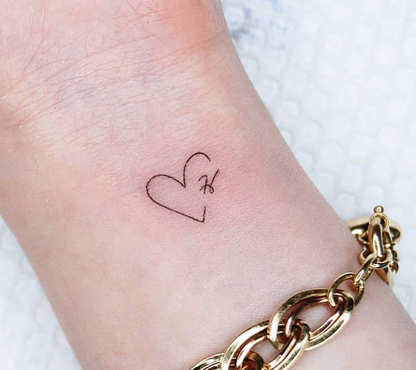 Small heart-shape H tattoo by @tattoo.choi