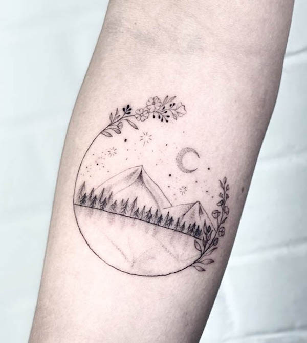 Floral landscape tattoo by @anyma.tattoo