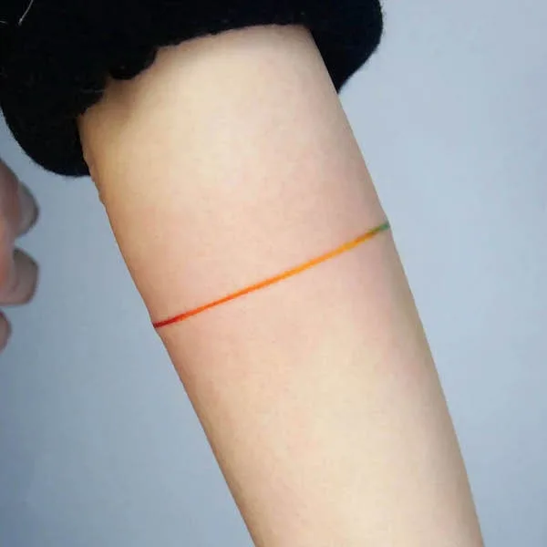 Rainbow line armband tattoo by @tattooist_mate