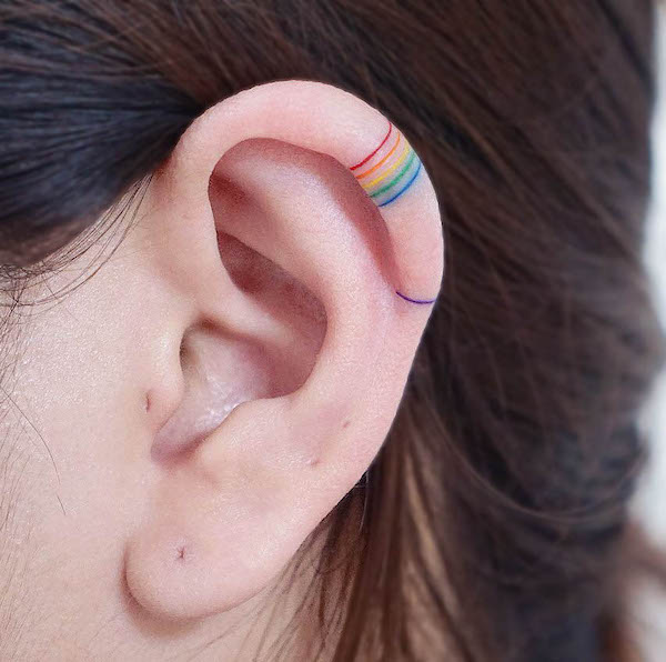 Small rainbow lines ear tattoo by @sey8n