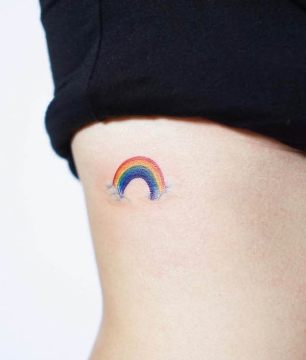 Small rainbow on the waist by @tattooist_silo
