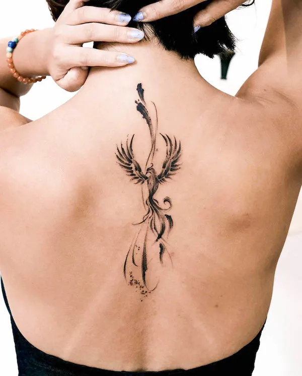 Black phoenix tattoo by @tattooist_jaymee