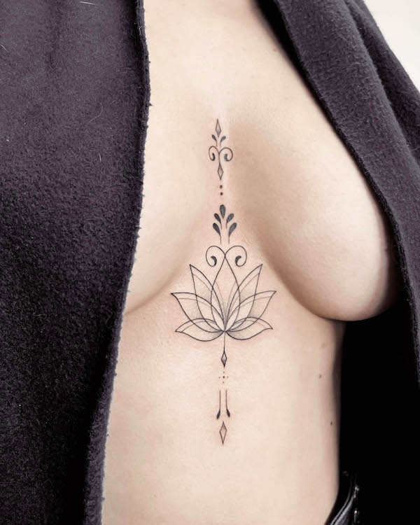 Lotus flower symbol tattoo by @michalska.tattoo