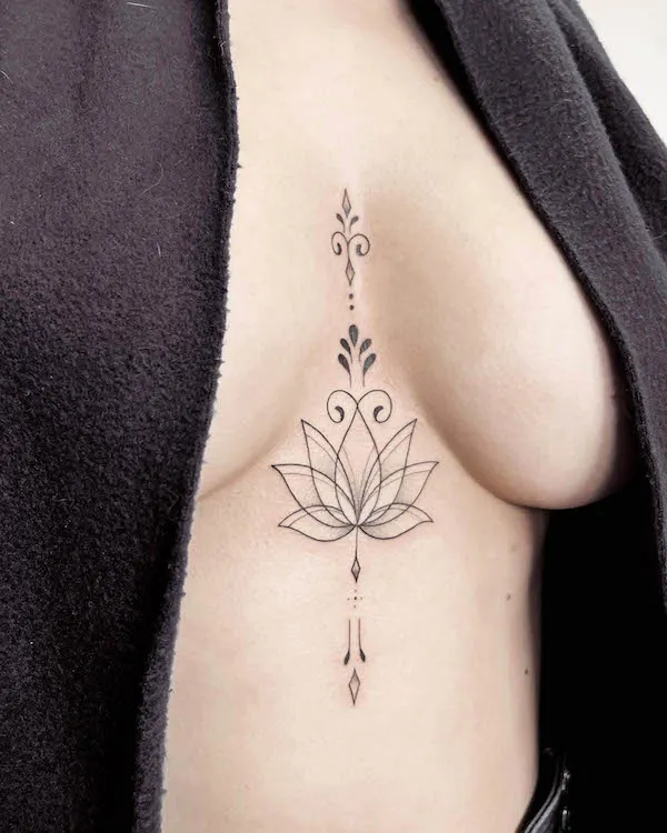 Lotus flower symbol tattoo by @michalska.tattoo