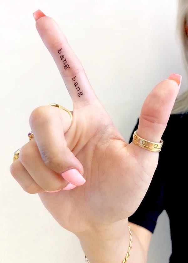 Word art tattooed on the finger