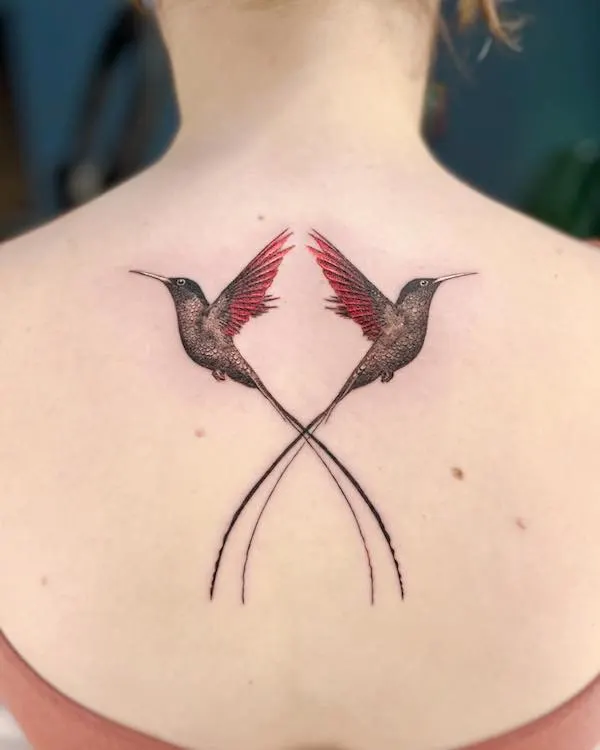 Bird tattoo on the back by @yuna.tattoos