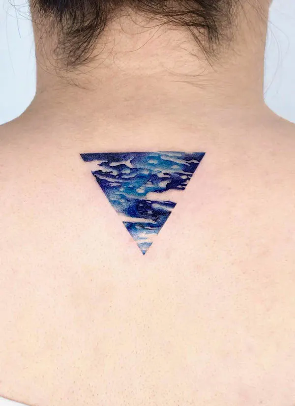 Blue abstract triangle back tattoo by @rizn__tattoo