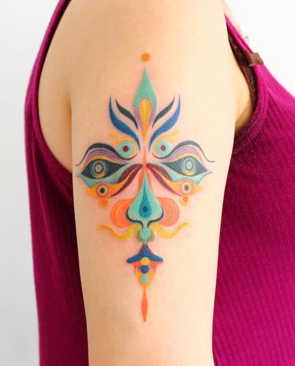 Colorful mask sleeve tattoo by @katia.zuela