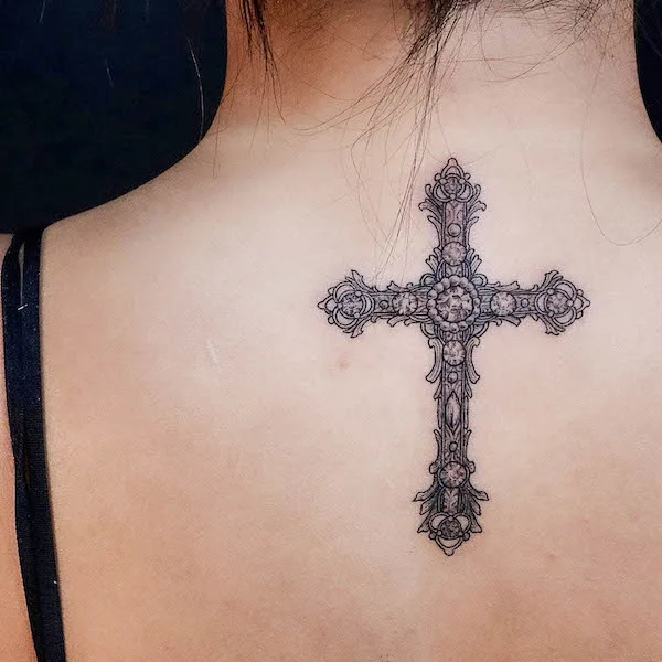 Vintage cross back tattoo by @ink_de_oro