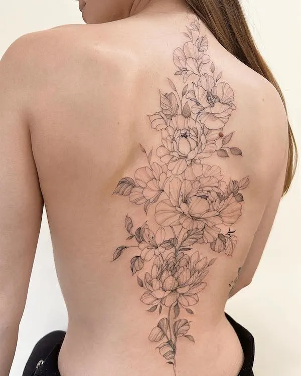 Black and grey flower tattoo by @peaudvoyou