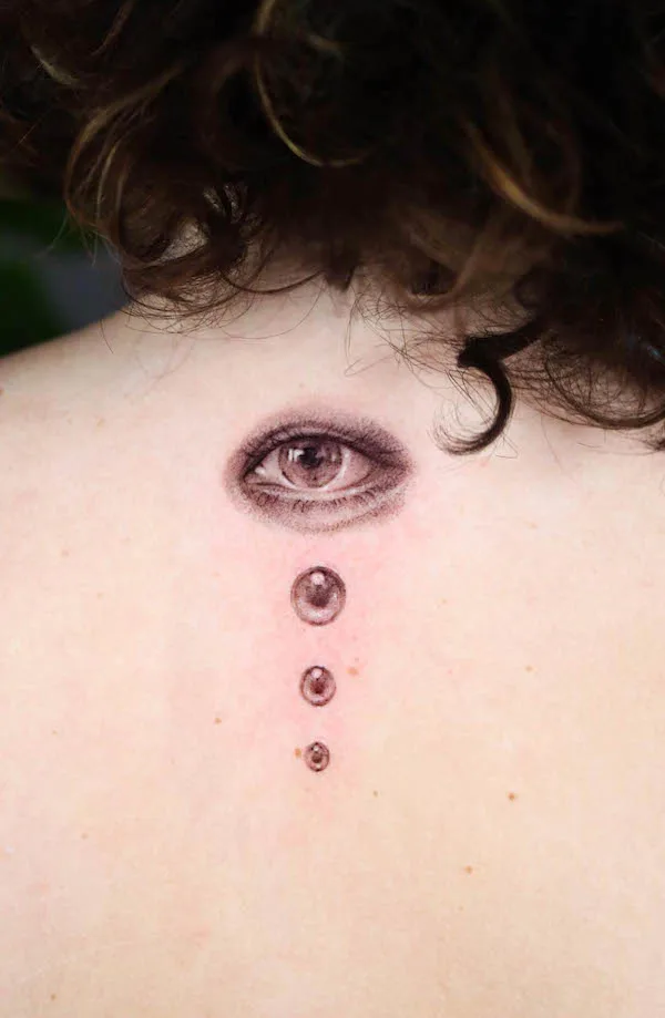 Realism eye tattoo on the back by @6o9ang