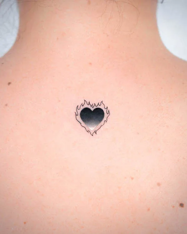 Small black burning heart by @o.ri_tattoo